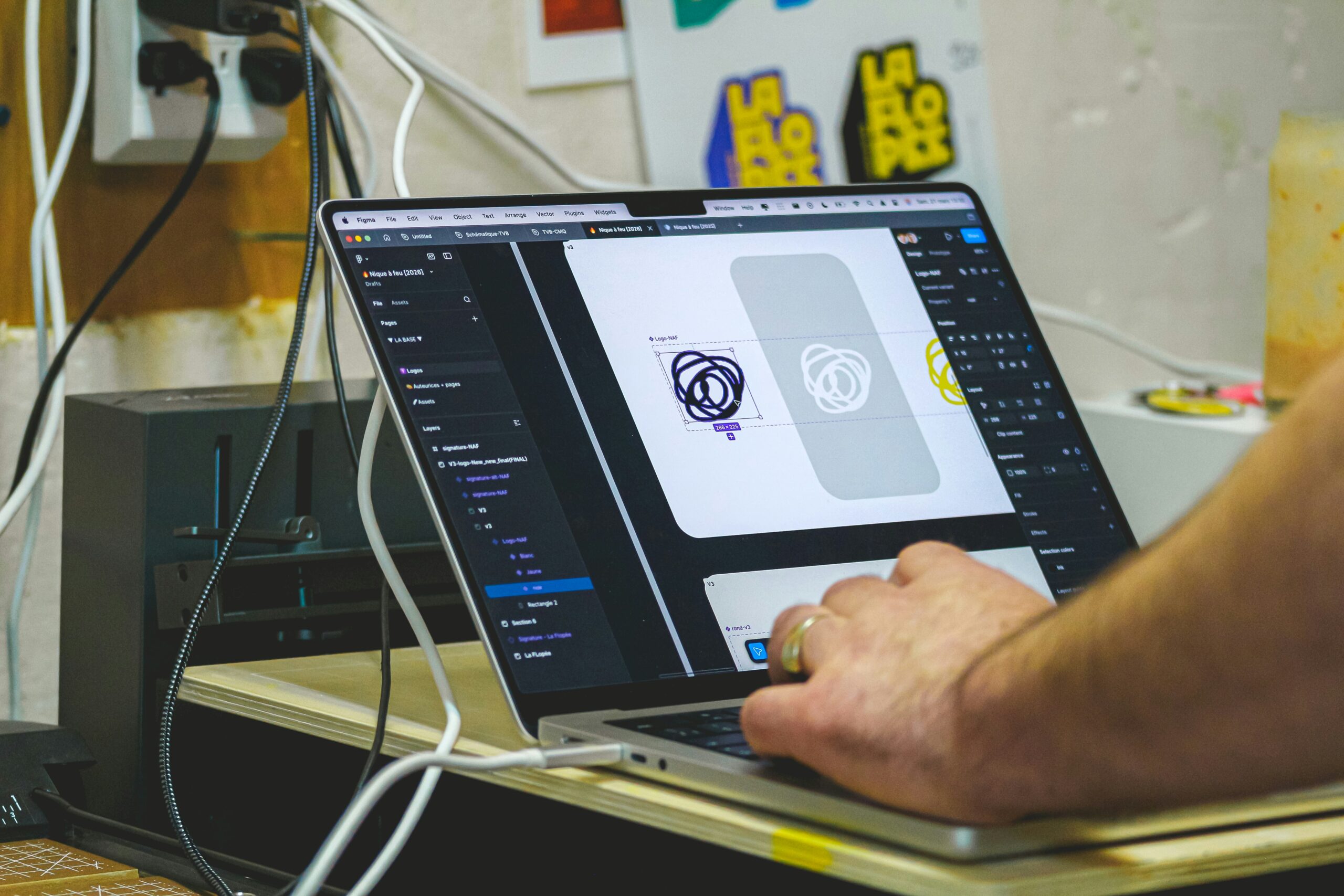 Creative designer working on a laptop in a modern studio